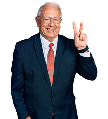 Senior man with grey hair wearing business suit and glasses showing and pointing up with fingers...