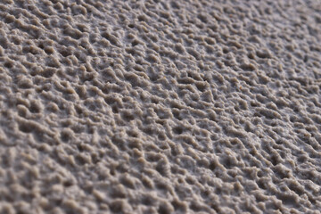White sand with a pattern formed by rain drops