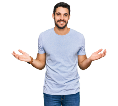 Young hispanic man wearing casual clothes smiling showing both hands open palms, presenting and advertising comparison and balance