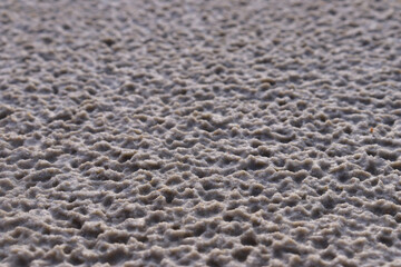 White sand with a pattern formed by rain drops