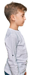 Little caucasian boy kid wearing casual clothes looking to side, relax profile pose with natural face with confident smile.