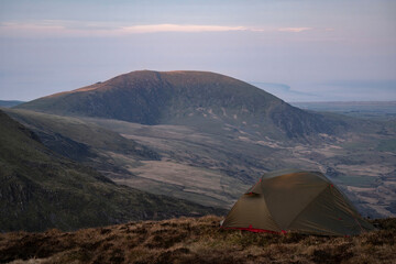 A wild camping tent in the mountains of Wales UK Snowdonia