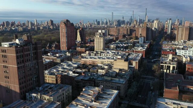 Crisp aerial stationary shot with Harlem NYC rooftops with the Upper East and West sides and Midtown in view