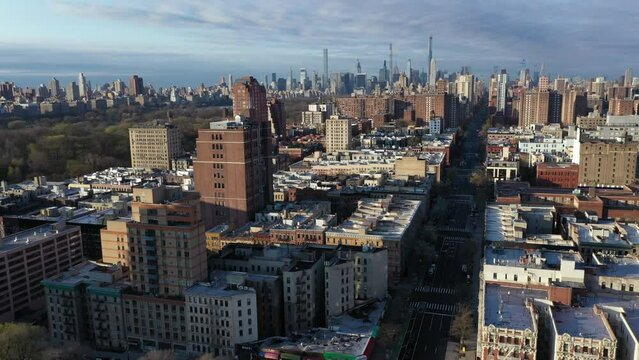 Very crisp aerial trucking shot over Harlem NYC with the Upper West, Upper East sides, and Midtown in the distance