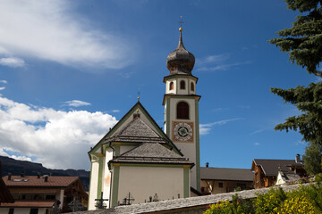 Fototapeta na wymiar SAN CASSIANO, ITALY, AUGUST 30, 2021 - View of San Cassiano parish, South Tyrol, Bolzano province, Italy.