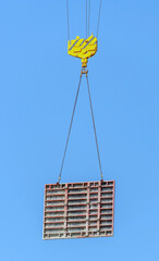 Crane hook in blue sky background