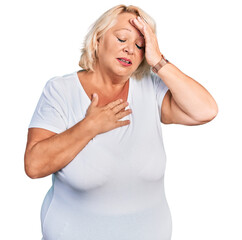 Middle age blonde woman wearing casual white t shirt touching forehead for illness and fever, flu and cold, virus sick