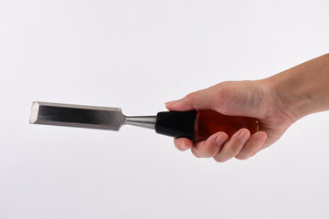 Hand holding wood chisels isolated on white background