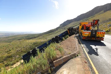 Foto op Canvas A lorry left the road and overturned on Du Toits Kloof Pass near Paarl, Western Cape, South Africa. © Jacques Hugo