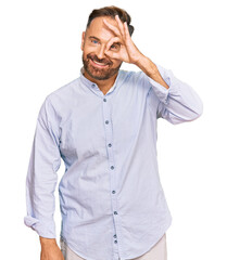 Handsome middle age man wearing business shirt doing ok gesture with hand smiling, eye looking through fingers with happy face.