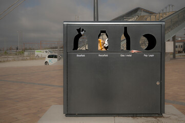 trashcan for sorting litter in different holes