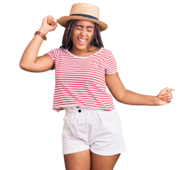 Young african american woman with braids wearing summer hat dancing happy and cheerful, smiling moving casual and confident listening to music