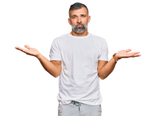 Middle age handsome man wearing casual white tshirt clueless and confused with open arms, no idea concept.