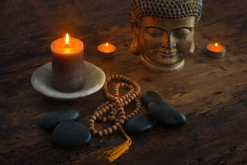 Fototapeten candles, stones, buddha head. zen concept. © Juliana Belo  