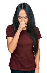 Young hispanic girl wearing casual t shirt feeling unwell and coughing as symptom for cold or bronchitis. health care concept.