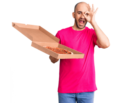 Young handsome man holding delivery pizza cardboard box smiling happy doing ok sign with hand on eye looking through fingers