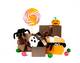 halloween symbols in gift boxes isolated on white background closeup