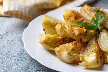 Organic Baked Fennel Bulbs with Salt and Pepper. Fennel dish with olive oil.
