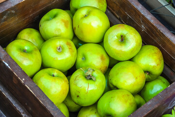 Apples in the wooden box.