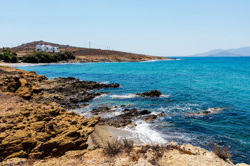 Fototapeta na wymiar Beach with shallow crystal clear sea water, in Naxos island. Cyclades Greece. Europe