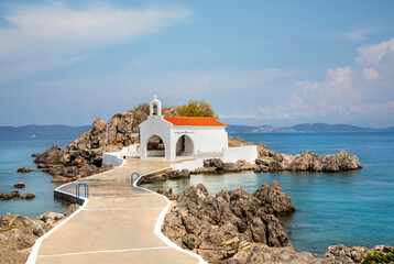 Authentic traditional Greek islands- unspoiled Chios, little church in the sea over the rocks Agios...