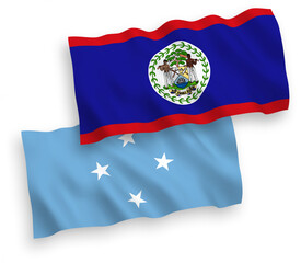 National vector fabric wave flags of Federated States of Micronesia and Belize isolated on white background. 1 to 2 proportion.