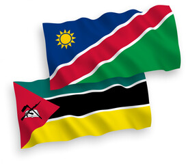 Obraz premium National vector fabric wave flags of Republic of Mozambique and Republic of Namibia isolated on white background. 1 to 2 proportion.