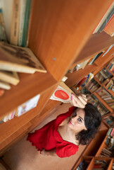 Back to school with attractive librarian in red dress