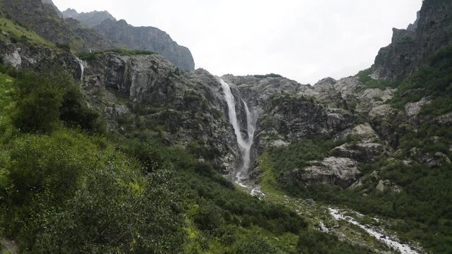Shdugra waterfalls at Georgia Svaneti region. Shdugra waterfall &ndash; the tallest waterfall of Georgia in Svaneti, near Mestia, Caucasian mountains. Hike from Mazeri to Ushba glacier.