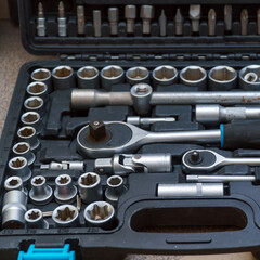 A set of socket wrenches. Locksmith tools in a box. A tool for car repair. Selective focus