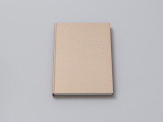 Beige Notebook Mockup with textured kraft hardcover on gray table. 3d rendering