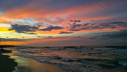 Obraz premium Tramonto in spiaggia