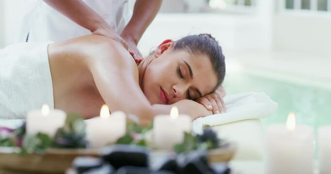 Relax, spa and luxury body massage treatment at a wellness, health and beauty salon. Woman with a calm, healthy and selfcare lifestyle getting body care and natural back therapy at a cosmetic salon.