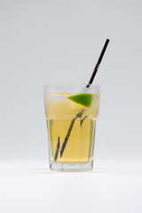 fresh cold fruit citrus lemonade drink with lime or lemon, ice, straw isolated