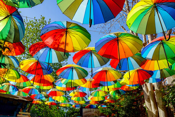 Fototapeta na wymiar Colorful rainbow umbrella street decoration for background