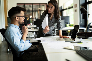 Colleagues arguing in office. Angry businesswoman yelling at her collegue
