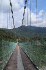 Obraz premium suspension bridge in the moutain