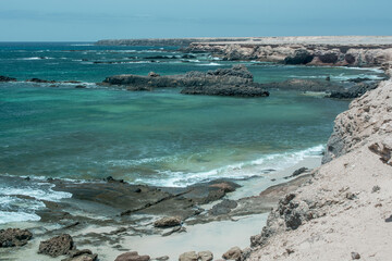 Summer beach, ocean waves on a tropical sea with deep blue wawes.