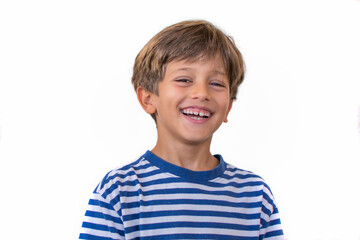 Little elementary age boy smiling.Child on a white background.  Happy	