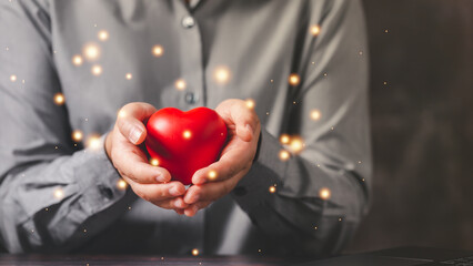Empathy female manager holding human icon with heart shape over palm hands. Power of emotional...