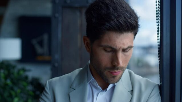 Rich man drinking cognac in luxury interior portrait. Businessman relaxing