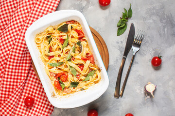 Fetapasta. Trending viral Feta bake pasta recipe made of cherry tomatoes, feta cheese, garlic in casserole dish.