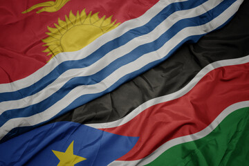 waving colorful flag of south sudan and national flag of Kiribati .