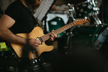 Obraz na płótnie Canvas Close up musician playing electric guitar