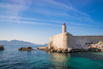 Chateau d'If castle lighthouse seen from a boat in the Frioul archipelago offshore from Marseille, France