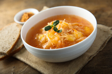 Traditional homemade sauerkraut soup with fresh parsley