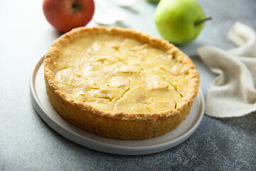 Traditional homemade apple pie with vanilla cream
