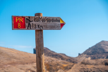 Pr8 footpath plaque from Ponta de Sao Lourenco in summer towards Cais do Sardinha, Madeira coast