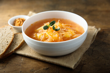 Traditional homemade sauerkraut soup with fresh parsley