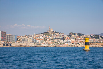 Skyline of Marseille with a view on the 7th arrondissement, Endoume district, Pointe d'Endoume and Pointe Cadiere from the Mediterranean sea  - obrazy, fototapety, plakaty